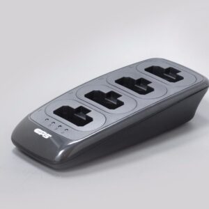 A black and grey CS28 Four Slot Charger for CPS Telecom Radios with three sockets, designed for charging multiple radios, shown against a plain light background.