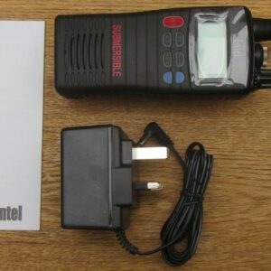 entel-ht644-what-you-get The Entel HT644 Marine VHF Walkie Talkie set, including a handheld radio, quick start guide, power adaptor, and charging dock, is displayed on a wooden surface.