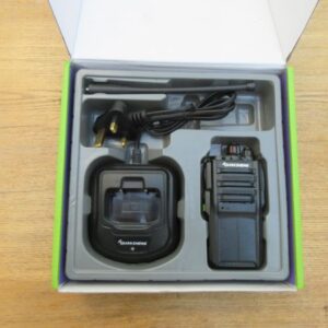 quansheng-tg330-walkie-talkie-box-contents Box containing a Quansheng TG330 Walkie Talkie Radio, charging dock, plug, and aerial neatly arranged in moulded packaging on a wooden surface.