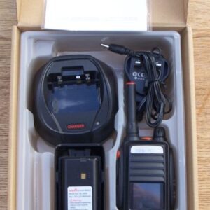 A Tesunho TH388 Display GPS Network Walkie Talkie Radio, charger, battery, and user manual are neatly arranged in a cardboard box.