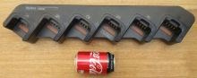 Hytera PD705 six slot charger next to Coke can